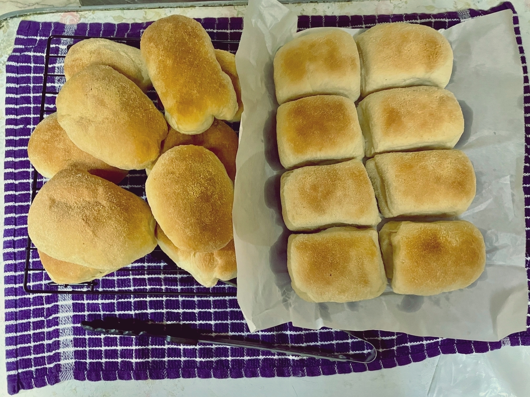 baked plain pandesal on the left, filled with corned beef are on the right