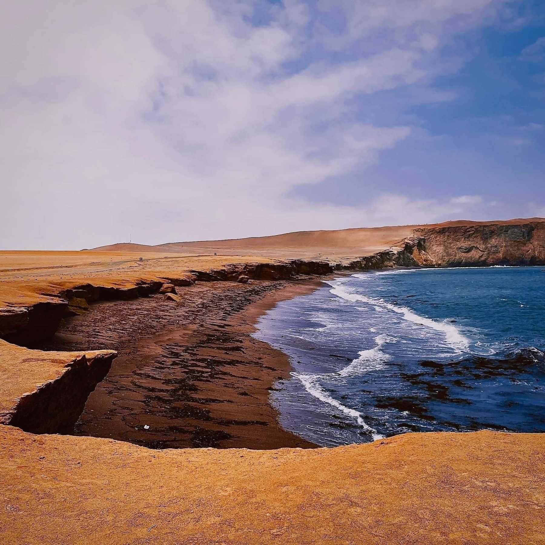 The red sand of Playa Roja contrasts beautifully with the blue waters.
