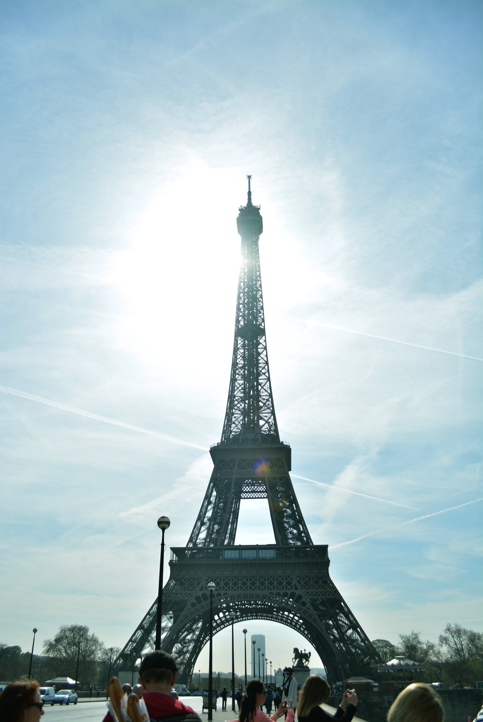 Sun shining behind the Eiffel Tower cast a flare of blinding light.