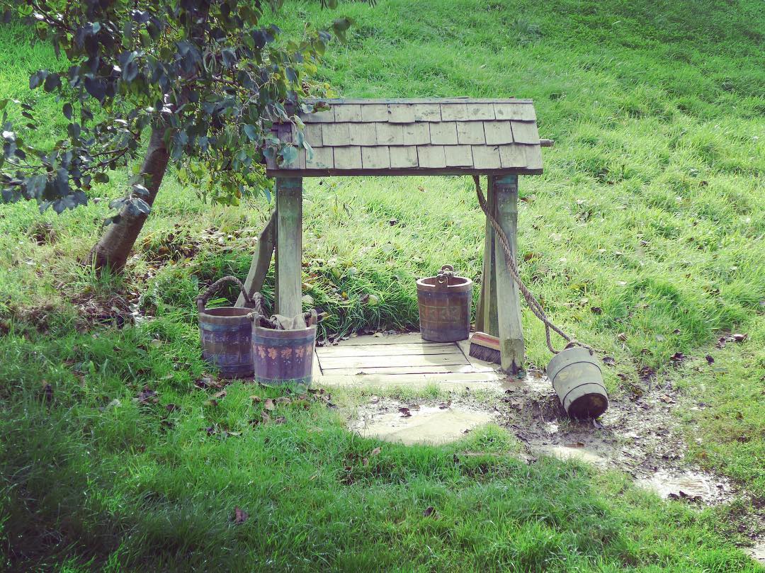 buckets on the ground used to get water from presumably a covered well