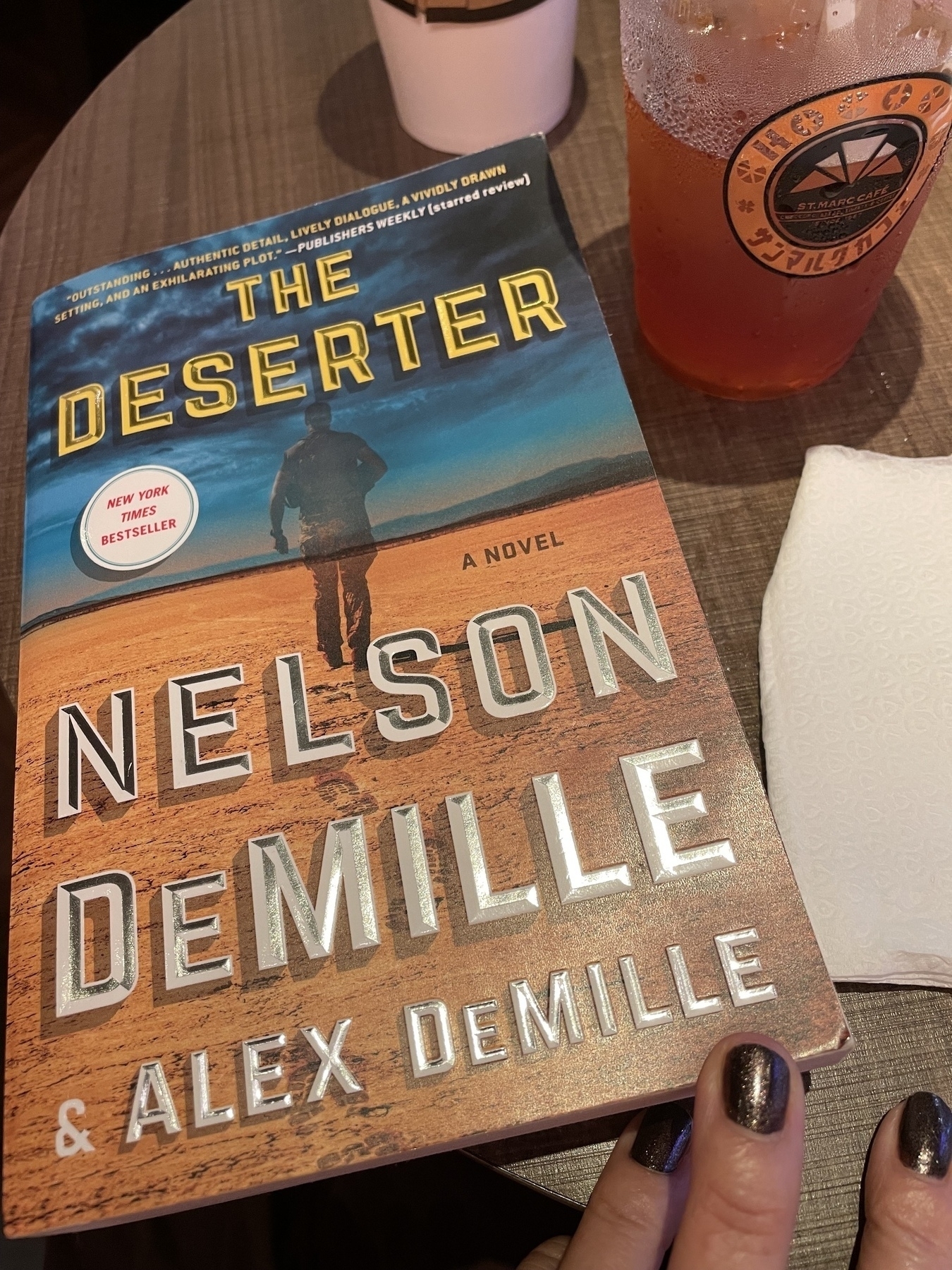 A softcover copy of the novel The Deserter by authors Nelson and (son) Alex DeMille